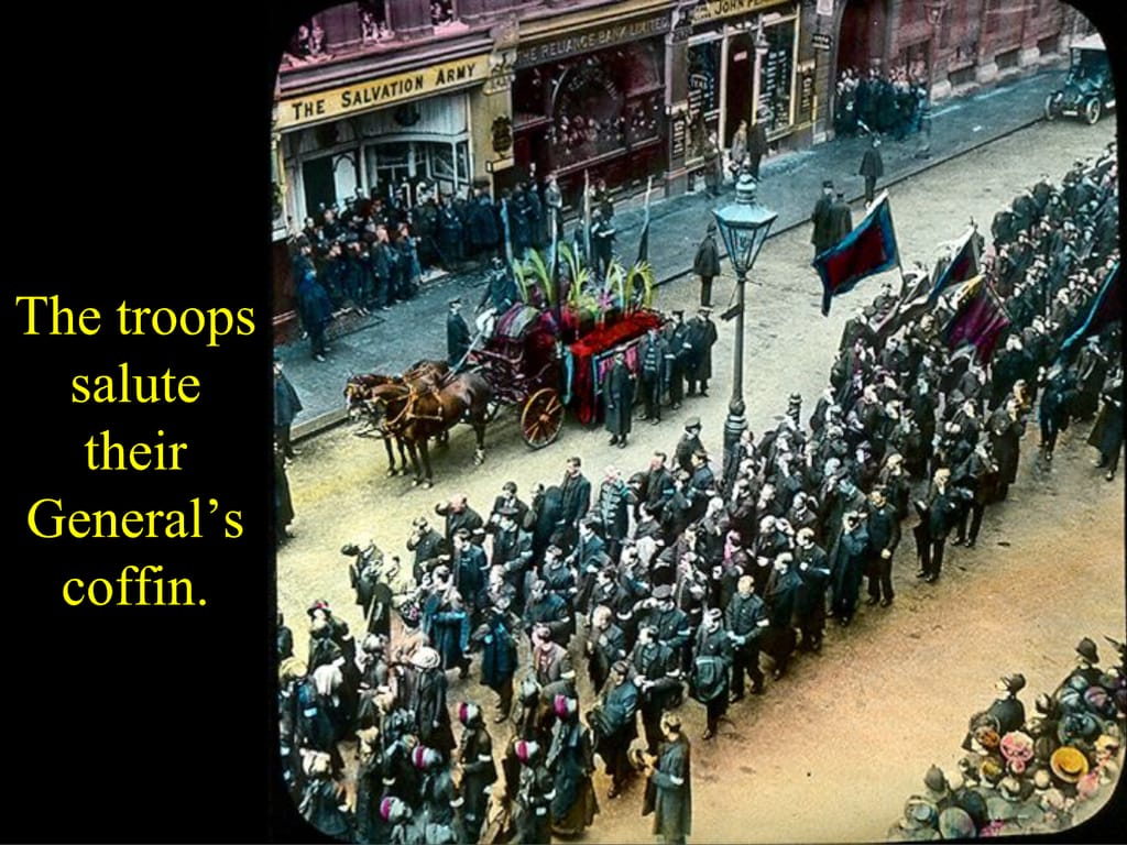 The troops salute their General’s coffin.
